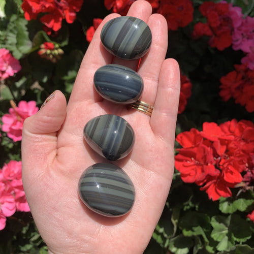 gray obsidian palm stones